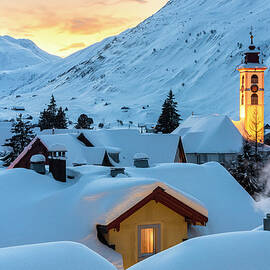 Switzerland, Uri, Andermatt, Alps, The Alpine Village Of Andermatt In The Winter Evening by Alessandro Bellani