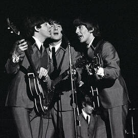 The Beatles 1964 Us Tour. L-r Paul by Popperfoto