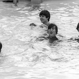 The Beatles In Swimming Pool by Express Newspapers