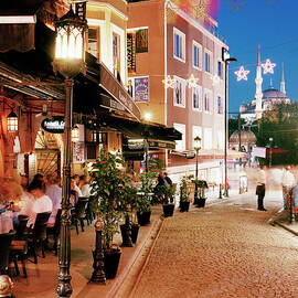 Tourists Dining Outside Restaurants At by Gary Yeowell