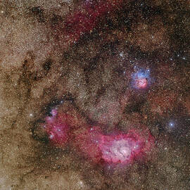 Trifid Nebula And Lagoon Nebula by Phillip L Jones