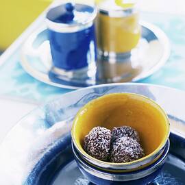 Truffle Pralines In Ceramic Bowls by Matteo Manduzio