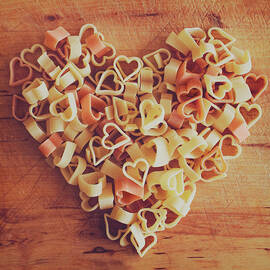 Uncooked Heart-shaped Pasta by Julia Davila-lampe