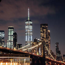 United States, New York City, Brooklyn, East River, Dumbo, Brooklyn Bridge, Brooklyn Bridge Park, View Of Lower Manhattan Skyline With The One World Trade Center, Formerly Freedom Tower. by Antonino Bartuccio