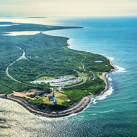 Usa, New York, Long Island, Aerial View Of Montauk Point Lighthouse Surrounded By Green Field And Ocean. by Alejandra Uribe Posada