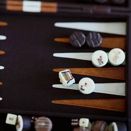 Various Chocolates On A Backgammon Board by Tanja Major