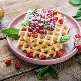 Waffles With Wild Strawberries, Red Currants, And Confectionery Sugar by Dorota Indycka