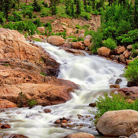 Waterfall Cascading Down A Mountainside by Kim Kozlowski Photography Llc