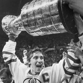 Wayne Gretzky Lifts The Stanley Cup by Bettmann