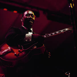 Wes Montgomery Performs On Stage At by David Redfern