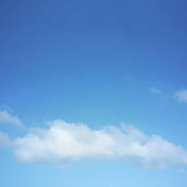 White Clouds Against Blue Sky by Dougal Waters