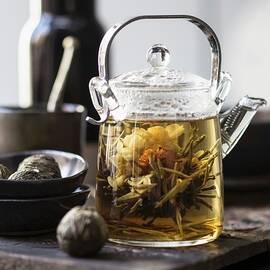 White Tea In A Glass Teapot With A Tea Flower by Great Stock!