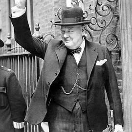 Winston Churchill showing the v sign by English School