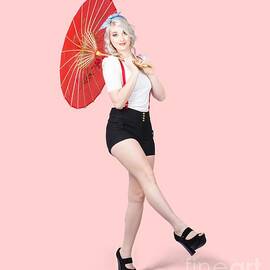 Young beautiful pin up woman posing with umbrella by Jorgo Photography