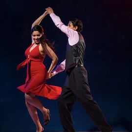 Young Couple Swing Dancing Indoors by Pm Images