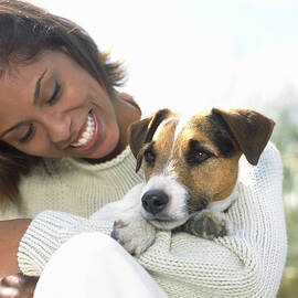Young Woman Holding Jack Russell by Todd Pearson