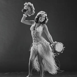 Young Woman Hula Dancer With Feathered by Tom Kelley Archive