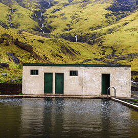 Geothermal swimming pool Seljavallalaug in south Iceland by Miroslav Liska