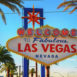 Iconic Welcome to Fabulous Las Vegas Nevada sign with palm trees by Miroslav Liska