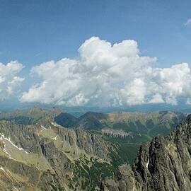 Majestic Mountain Range Under Clouds by Robert Grac