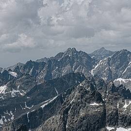 Majestic Mountain Range Under Cloudy Sky by Robert Grac