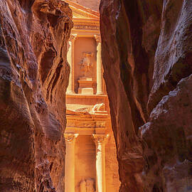 Petra Treasury building facade seen through narrow gorge by Steven Heap