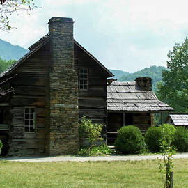 1800s log farm home in the mountains by Flees Photos