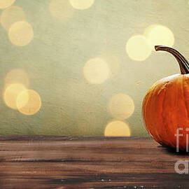Autumn pumpkins still life on vintage wooden table and rustic ba by Jelena Jovanovic