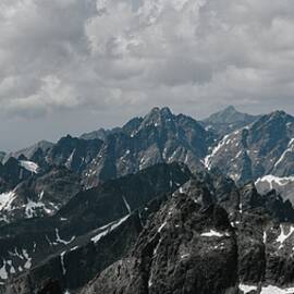 Majestic Mountain Range Under Clouds by Robert Grac
