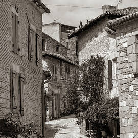 Narrow streets and picturesque buildings in hilltop medieval Pen by Seeables Visual Arts