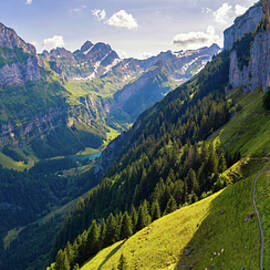 Swiss Alps and a restaurant under a cliff on mountain Ebenalp in Switzerland by Miroslav Liska