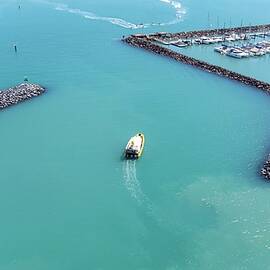 A boat out of harbour by Andre Petrov