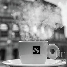 A cup of black coffee in front of Colosseum in Rome by Stefano Senise