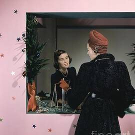 A Model Doing Some Christmas Shopping by John Rawlings