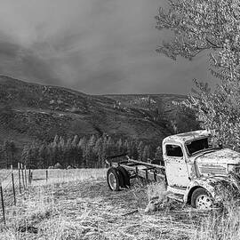Abandoned Truck in a Field by Michael DeGrenier