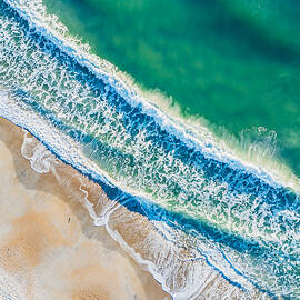Aerial View of Sandy Beach by Oceanic SkyView