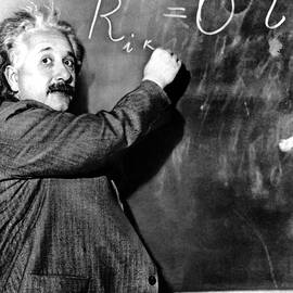 Albert Einstein writing on a blackboard by The Luxury Art Collection
