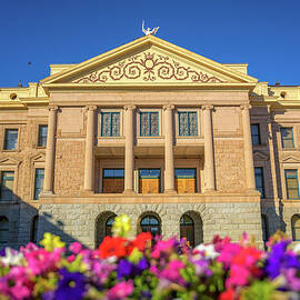 Arizona State Capitol in Phoenix, AZ, with colorful flowers in the foreground by Miroslav Liska