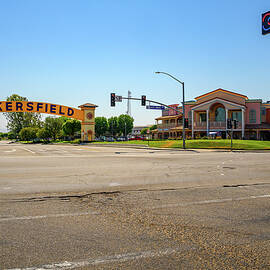 Bakersfield arch sign over the road on a sunny day with clear skies by Miroslav Liska