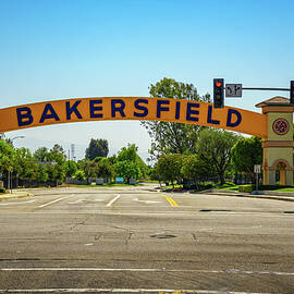 Bakersfield welcome sign over the road on a clear day by Miroslav Liska
