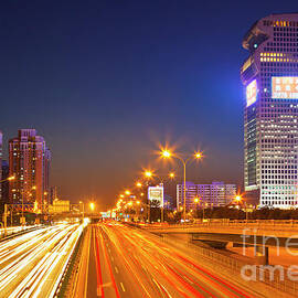 Beijing traffic and Skyline, China by Neale And Judith Clark