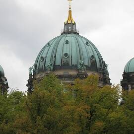 Berlin's Majestic Dome Amidst Verdant Canopy by Travel Essayist