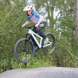 Biker Jumps Over Ramp 2402 by Donn Ingemie