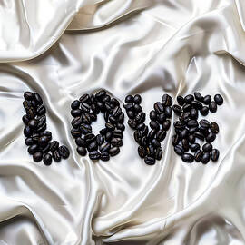 Black_coffee_beans_as_word_Love_on_white_silk_background_1 by Andre Petrov