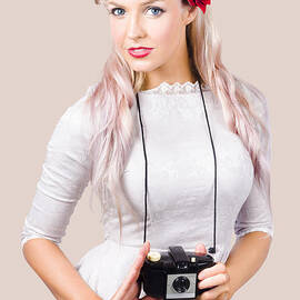 Blond woman with camera by Jorgo Photography