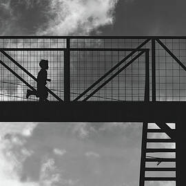 Boy running on highway bridge in Guatemala BW by Tatiana Travelways