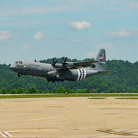 c 130 super hurcules taking off by Flees Photos