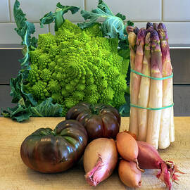 Choice vegetables on a chopping board in a kitchen by Seeables Visual Arts