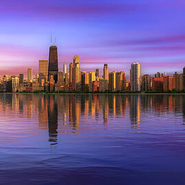 Colorful sunset above Chicago skyline across Lake Michigan by Miroslav Liska