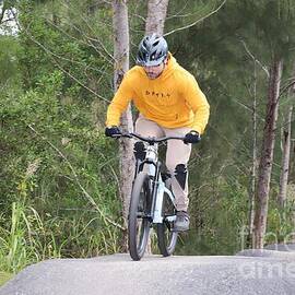 Cyclist Riding a Mountain Trail  2394 by Donn Ingemie